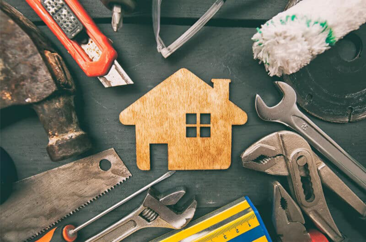 House surrounded by maintenance tools