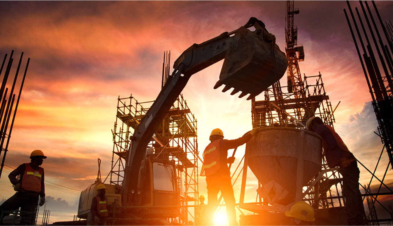 workers on site during sunset